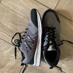 New Balance gray and red running shoe.